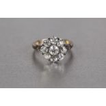 LATE VICTORIAN 18ct GOLD AND DIAMOND DAISY CLUSTER RING, set with nine old cut diamonds, the