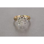 18ct GOLD AND DIAMOND DOMED CLUSTER RING OF FOUR FOUR TIERS, twenty three diamonds, the centre