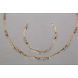 9ct GOLD TWO ROW FINE BEAD NECKLACE, seven knotted gold wire pattern dividers, 18" long and the
