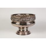 A WALKER AND HALL ELECTROPLATED PEDESTAL ROSE BOWL, with embossed border of foliate scrollwork, 10