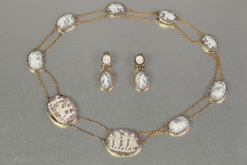 GEORGIAN DEMI-PARURE SARDONYX SHELL CAMEO NECKLACE AND PAIR OF EARRINGS in unmarked gold settings,