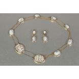 GEORGIAN DEMI-PARURE SARDONYX SHELL CAMEO NECKLACE AND PAIR OF EARRINGS in unmarked gold settings,