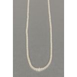 SINGLE STRAND NECKACE OF GRADUATED NATURAL SALTWATER, SMALL PEARLS with 18ct GOLD OBLONG CLASP set