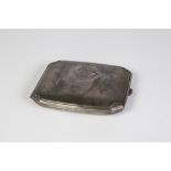 GERMAN SILVER COLOURED METAL POCKET CIGARETTE CASE, oblong and cushion shaped with canted corner