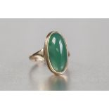 A MODERN 9ct GOLD LARGE CABOCHON GREEN STONE SET DRESS RING, hallmarked Birmingham 1970, the