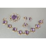 FIVE PIECES OF 9ct GOLD AND AMETHYST JEWELLERY VIZ, a RING collet set with an oval amethyst, size '