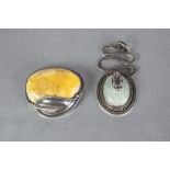 ART NOUVEAU PERIOD BROOCH set with yellow hardstone oval in a sterling silver single leaf