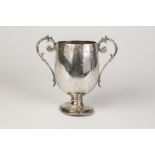 VICTORIAN TWO HANDLE PEDESTAL GOBLET, of ovoid form with strap work engraved decoration, foliate and