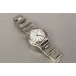 BULOVA "ACCUTRON" MID SIZE STAINLESS STEEL CASED WRIST WATCH white enamel dial with date aperture,