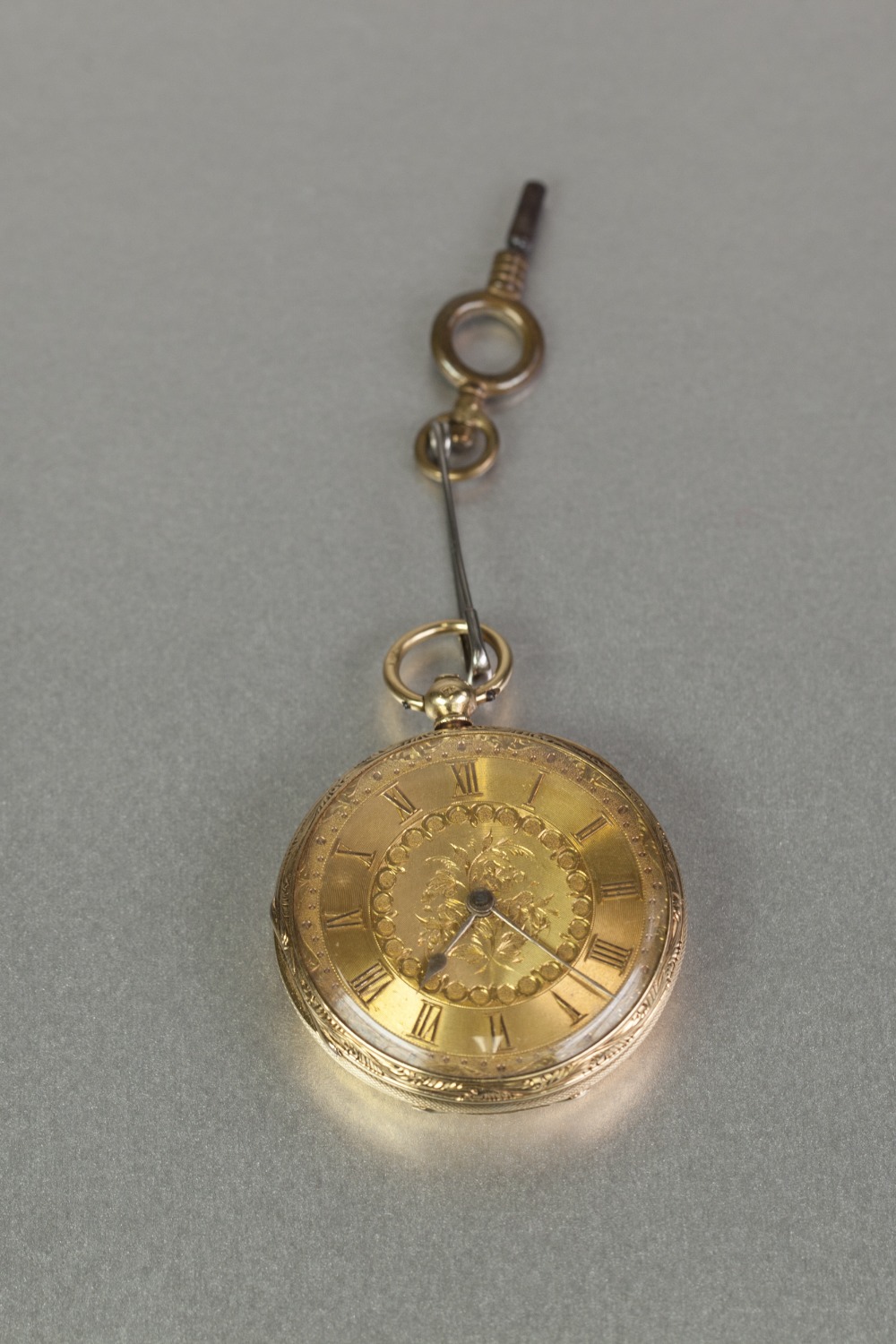 18ct GOLD POCKET WATCH with key wind movement, floral engraved gold roman dial, engraved case, 1 1/