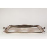 AN EARLY TWENTIETH CENTURY ELECTROPLATED SHAPED-OBLONG TWO HANDLED TEA TRAY