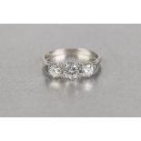 18ct WHITE GOLD RING, claw set with three round brilliant cut diamonds, centre stone approx .40ct,