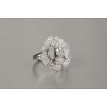 *18ct WHITE GOLD AND DIAMOND ROSE CLUSTER RING OF THREE TIER PETAL FORM set with numerous small