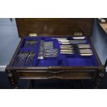AN ELECTROPLATE TABLE SERVICE OF EARLY ENGLISH CUTLERY FOR TWELVE PERSONS IN A JACOBEAN STYLE OAK