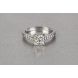 PLATINUM RING, set with a princess cut square diamond, weighing 1.01ct, in a four claw setting,