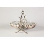 A LATE VICTORIAN/EDWARDIAN ELECTROPLATED FOLDING BREAKFAST DISH, opening to reveal its hinged and