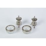 PAIR EARLY 20TH CENTURY SILVER PEPPERETTES baluster shape and raised on three scroll feet,