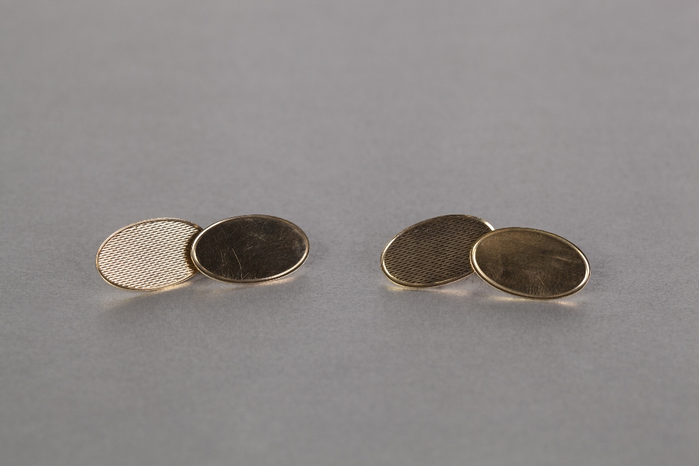 PAIR OF 9ct GOLD DOUBLE OVAL CUFF LINKS, with engine turned tops, in associated case, 4.7gms (2)