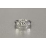 *18ct WHITE GOLD AND DIAMOND CLUSTER RING SET WITH CENTRE SQUARE PRINCESS CUT DIAMOND AND SQUARE