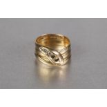 LATE VICTORIAN 18ct GOLD SNAKE RING, of broad three 'Coil' pattern, the head set with three tiny