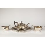 AN INTER-WAR YEARS ELECTROPLATED THREE PIECE TEA SERVICE on an associated oval galleried tray (4)