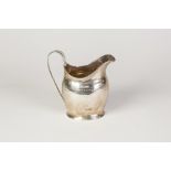 GEORGE III SILVER HELMET SHAPED CREAM JUG, with reeded banded border and raised 'C' scroll raised