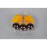 A RUSSIAN HARDSTONE AND AMBER SPRAY BROOCH, with gold coloured metal stem, two amber coloured leaves