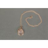 *18ct ROSE GOLD, ROSE QUARTZ AND DIAMOND PENDANT, set with a large high cabochon tear shaped rose
