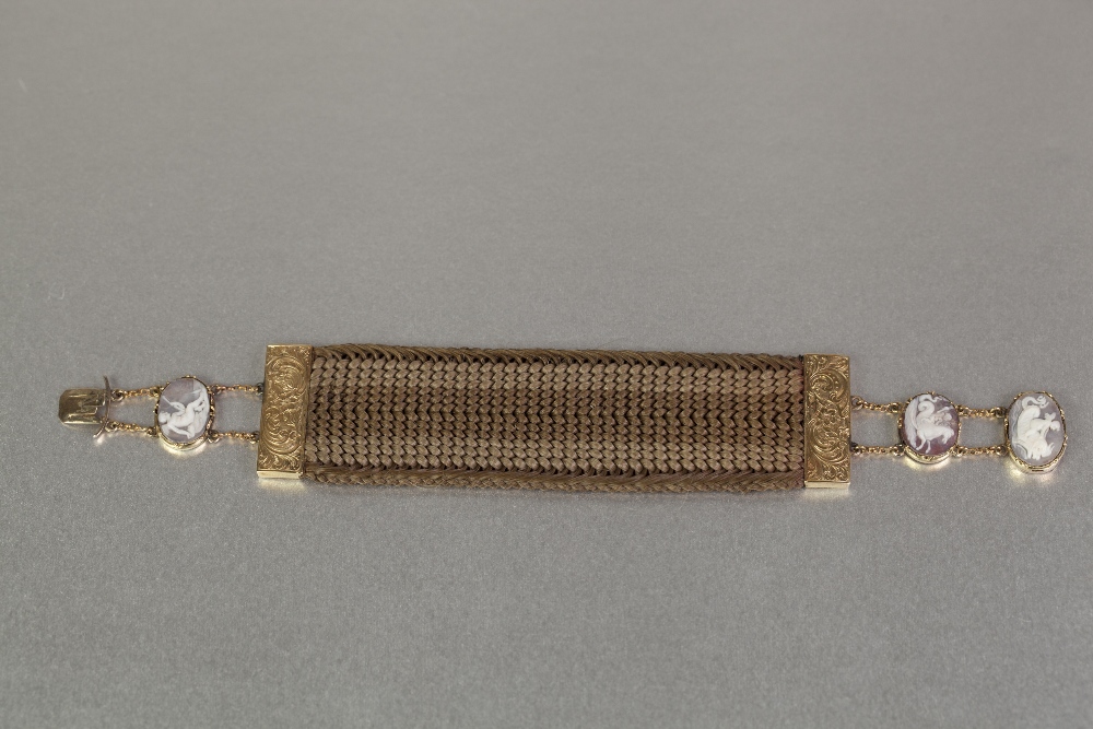 GEORGIAN BROAD, WOVEN HAIR BRACELET with engraved unmarked gold terminals and chain extensions