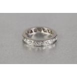 PLATINUM AND DIAMOND ETERNITY RING, set with eighteen round brilliant cut diamonds, each approx .