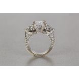 18ct WHITE GOLD RING, set with a square princess cut solitaire diamond, set on two 'V' shaped post