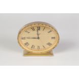 IMHOF, SWISS SMALL MANTEL CLOCK, with 8 days alarm movement, with gold coloured metal Roman oval
