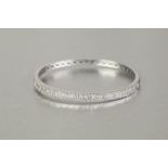 *14K WHITE GOLD AND DIAMOND HINGE OPENING BANGLE, the top half set with a row of baguette diamonds