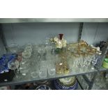 A COLLECTION OF CUT GLASS AND GILT DRINKING GLASSES, VIZ CHAMPAGNE FLUTES, WINES, BRANDY BALLOONS,