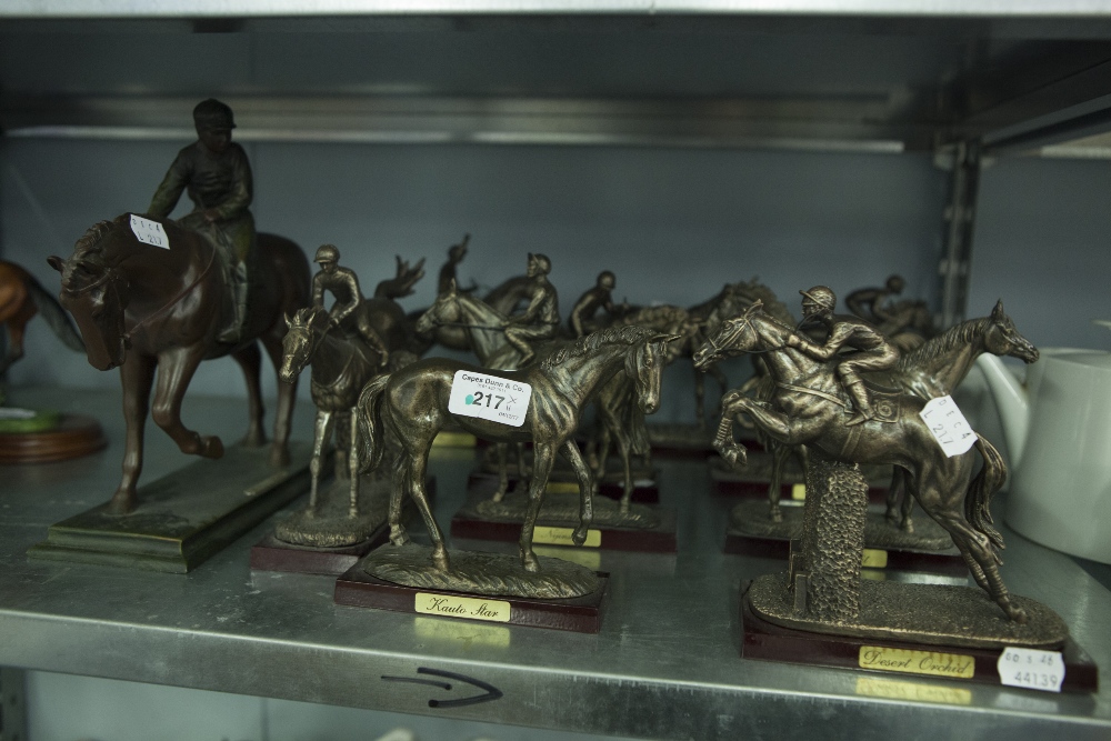 A SET OF TEN BRONZED RESIN MODELS OF RACE HORSES, FIVE WITH JOCKEY UP AND ANOTHER LARGER MODEL (11)