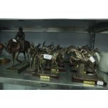 A SET OF TEN BRONZED RESIN MODELS OF RACE HORSES, FIVE WITH JOCKEY UP AND ANOTHER LARGER MODEL (11)