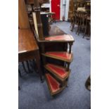 A LOW LONG SOFA TABLE, WITH LEATHER INSET TOP AND RAISED ON FOUR SUPPORTS WITH CROSS STRETCHER