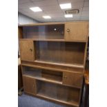 TWO MODERN OAK BOOKCASE CUPBOARDS, EACH WITH SLIDING GLASS FRONTS AND CUPBOARDS (2)