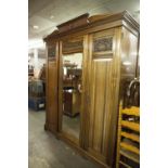 LARGE LATE VICTORIAN CARVED MAHOGANY WARDROBE OF ARCHITECTURAL STYLE WITH CENTRAL PEDIMENT TO THE