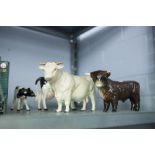 BESWICK POTTERY MODEL OF A CREAM COLOURED BULL, POTTERY MODELS OF A BLACK AND WHITE COW AND A