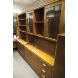 A SUTCLIFFE OF TODMORDEN TEAK 'S FORM' WALL UNIT, WITH DISPLAY SHELVING, THE BASE OF DRAWERS AND