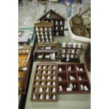 COLLECTION OF MAINLY PORCELAIN THIMBLES ON SIX WOODEN WALL DISPLAY RACKS (APPROX 93 THIMBLES)