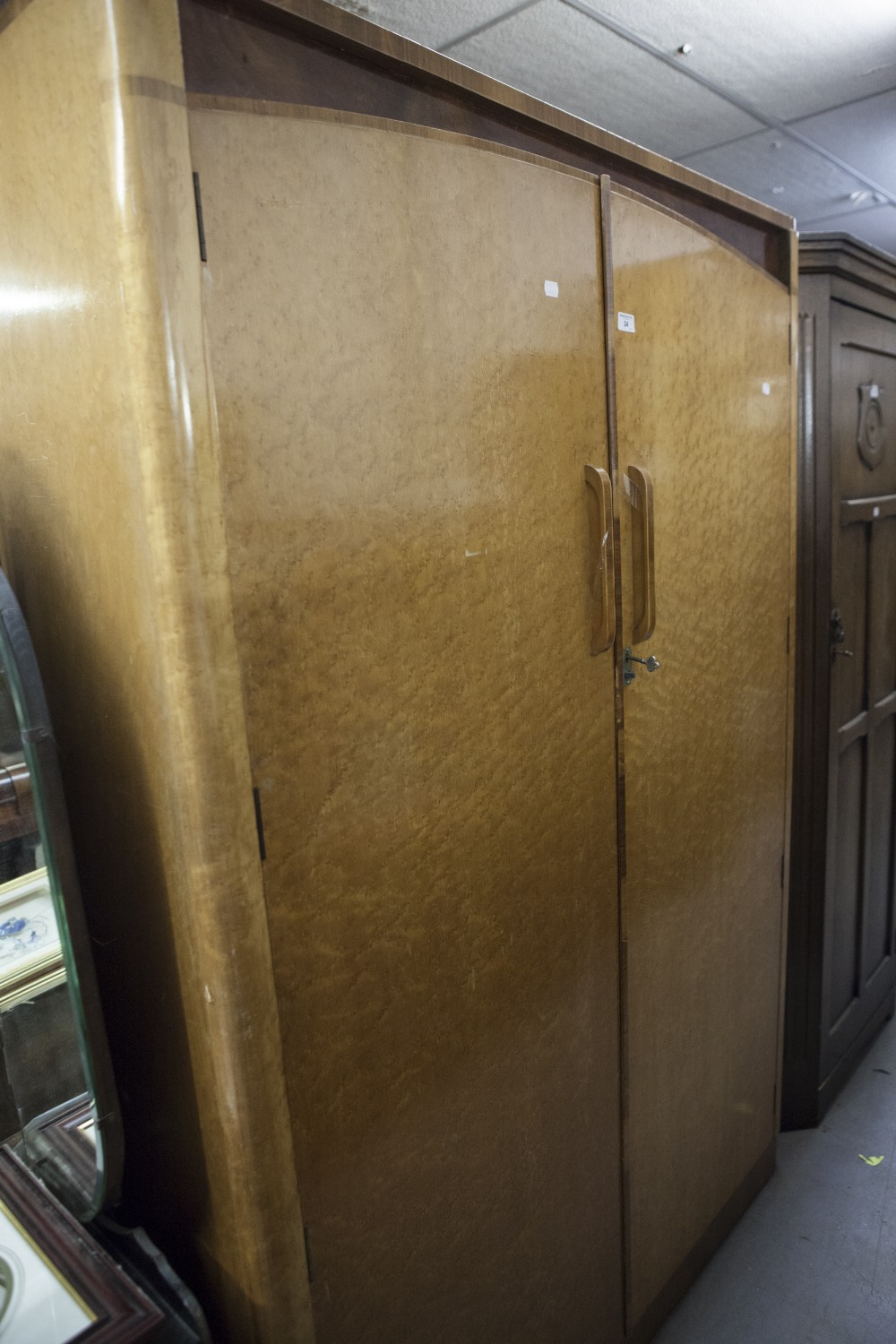 AN ART DECO BIRDSEYE MAPLE AND WALNUT DOUBLE GENTLEMAN'S WARDROBE, SOLID DOORS AND SHAPED HANDLES