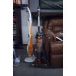 AN UPRIGHT BAGLESS VACUUM CLEANER AND A FLOOR POLISHER