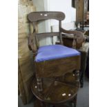 A DARK WOOD COMMODE CHAIR, SINGLE BACK RAIL SUPPORTS, SCROLL ARMS, PAD FEET ON TURNED FRONT SUPPORTS