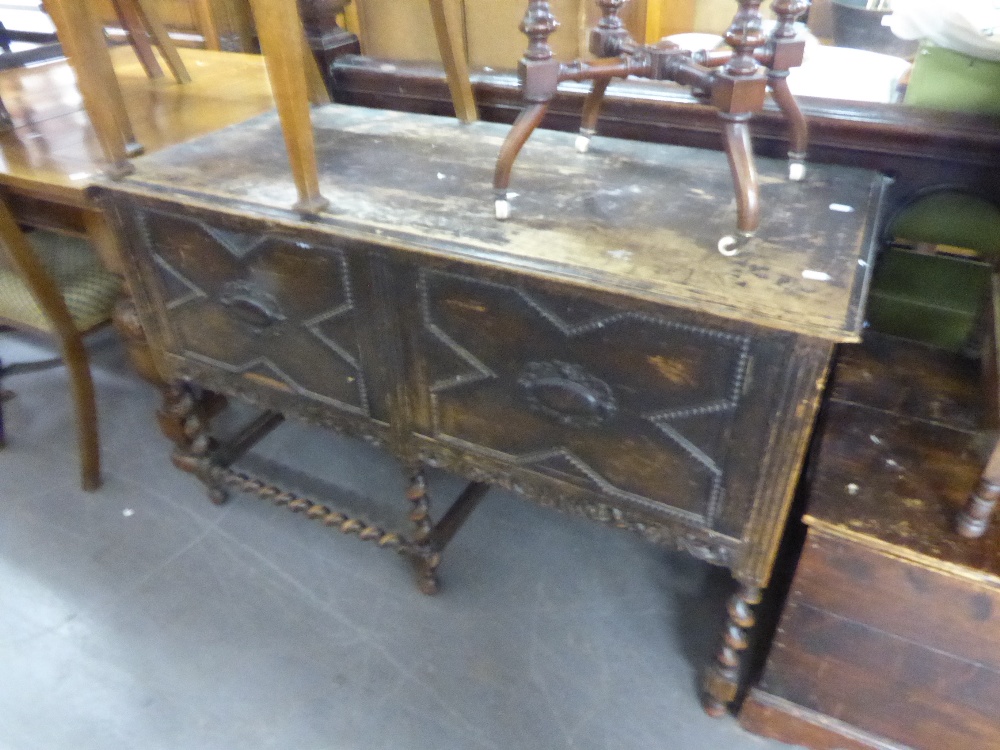 A DARK OAK SIDEBOARD CIRCA 1930's WITH TWO DOOR CUPBOARD 'X' BEAD DETAIL, PIERCED FLORAL PEDIMENT,