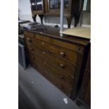 AN EARLY VICTORIAN MAHOGANY CHEST WITH THREE SHALLOW FRIEZE DRAWERS, OVER FOUR GRADUATED LONG