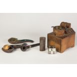 SWISS CARVED WOOD CIGARETTE DISPENSER WITH MUSICAL MOVEMENT, the box form and surmounted by a figure