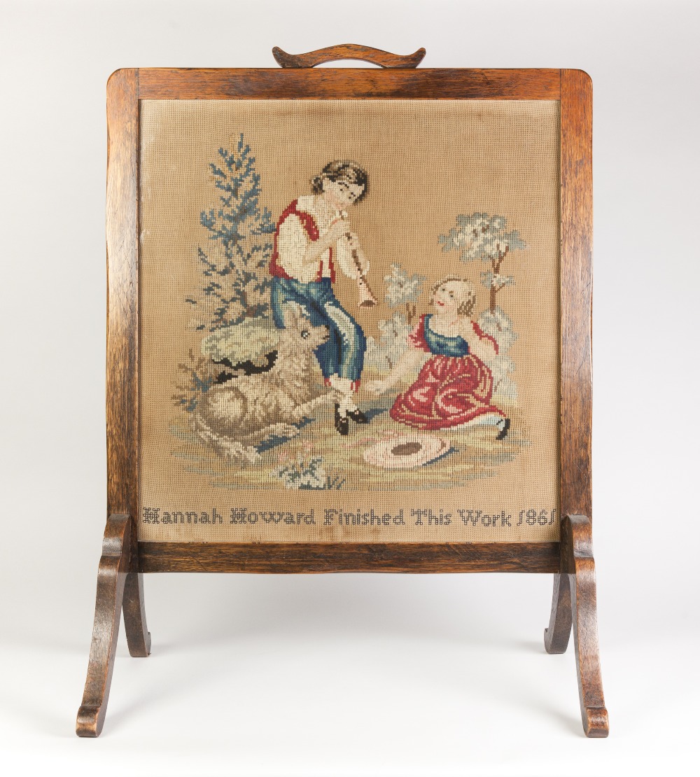 VICTORIAN OAK AND GLAZED CHEVAL FIRE SCREEN WITH HAND WORKED PICTORIAL PANEL DEPICTING A YOUNG BOY