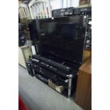 SONY LARGE FLAT SCREEN TELEVISION, 54" AND A SONY ACTIVE SPEAKER SYSTEM, ON BLACK GLASS TWO TIER